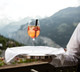 Glass of wine being held by waiter