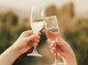 Three wine glasses with red wine in a celebratory toast